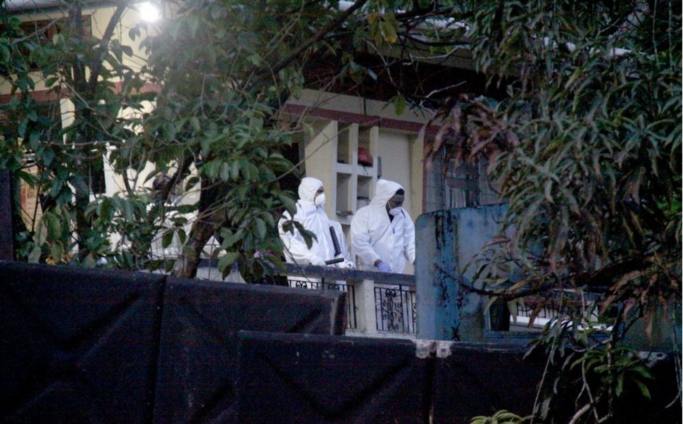 CSI officers at the scene of the triple murder at Clarke Road, Penal on Thursday. (Trinidad Guardian photo)