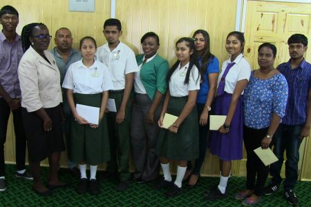 The students with parents, teachers and Regional Education Officer Nicolette Matthews and representative of Pinnacle Communications Ava Thompson