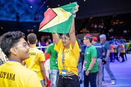 Team Guyana 2017 member Arrianna Mahase showing off the Guyana flag at the First Global Competition in Washington DC