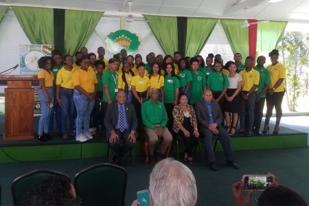 The apprentices from Youth in Natural Resources III pose for a photo with apprentices from the previous year. Seated from left are Minister of Natural Resources Raphael Trotman, President David Granger, Minister of State Dawn Hastings-Williams and Minster of Social Cohesion Dr George Norton.