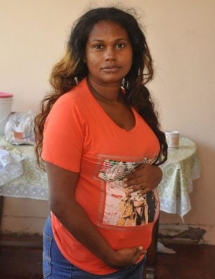 Indiera Garcia, 35, whose house was gutted by arsonists in February this year, is begging for assistance in rebuilding a new house. 