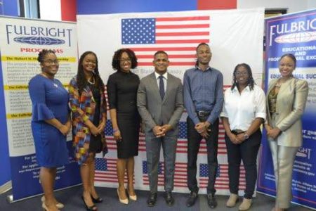 The newest batch of Jamaicans to benefit from US Government-funded International Exchange programmes and fellowships, Fulbright and Humphrey, left the island last week. Photographed with Jeremiah Knight (centre), counsellor for public affairs, US Embassy, Kingston, are (from left): Rochelle Channer Miller; Cerita Buchanan; Nicola Satchell; Chavon Rogers; Kelley-Ann Lindo; and Ren-Neasha Blake. 