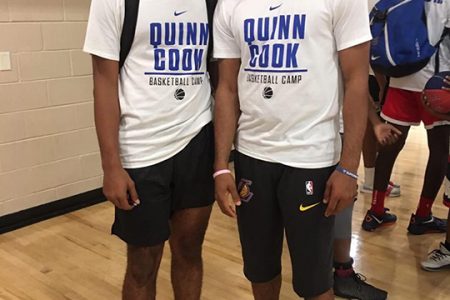 Jether Dean Harris stands beside Quinn Cook during the basketball camp in Maryland, USA.