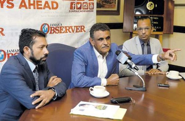 Senior plastic surgeon Dr Guyan Arscott gesticulates while addressing yesterday's Jamaica Observer Monday Exchange. Flanking him are colleague surgeons Dr Rajeev Venugopal (left) and Dr Pierre Leake. (Photo: Joseph Wellington) 