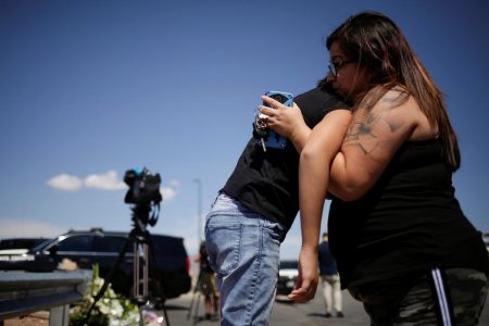 People react at the site of a mass shooting where 20 people lost their lives at a Walmart in El Paso, Texas, U.S. August 4, 2019. REUTERS/Jose Luis Gonzalez