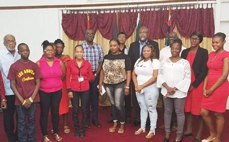 The families that received donations, along with members of the Fallen Heroes Foundation. Also in photo is Commissioner of Police (ag) Nigel Hoppie (centre). (Guyana Police Force photo)