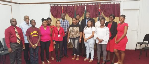 The families that received donations, along with members of the Fallen Heroes Foundation. Also in photo is Commissioner of Police (ag) Nigel Hoppie (centre). (Guyana Police Force photo)