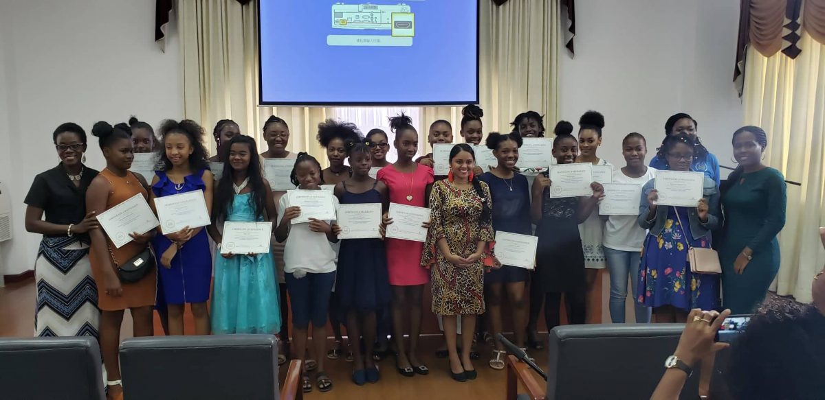 The participants with their certificates stand alongside their instructors at the mini-exhibition hosted for the ‘Guyanese Girls Code’ camp. (Photo by Terrence Thompson)