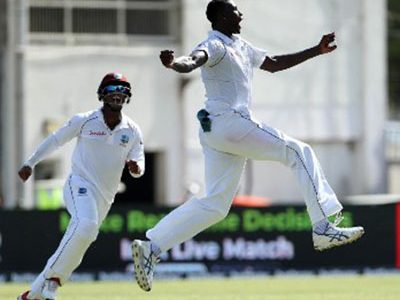 West Indies captain Jason Holder celebrates after claiming the prized wicket of India captain Virat Kohli on yesterday’s opening day of the second Test at Sabina Park.
