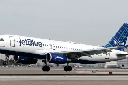 A Jetblue aircraft lands at a airport in the US.
