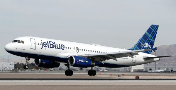 A Jetblue aircraft lands at a airport in the US.