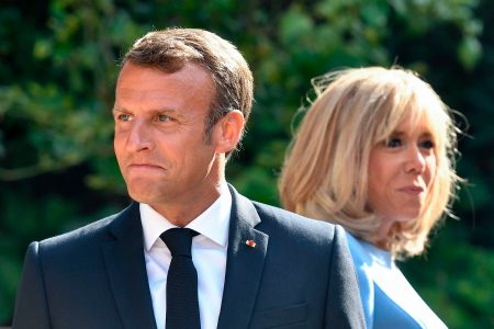  French President Emmanuel Macron (L) and his wife Brigitte Macron (R) wait for the arrival of the Russian President, at the French President' summer retreat of the Bregancon fortress on the Mediterranean coast, near the village of Bormes-les-Mimosas, southern France, on August 19, 2019, for talks days before the G7 Summit . (Photo by GERARD JULIEN / various sources / AFP)        (Photo credit should read GERARD JULIEN/AFP/Getty Images)