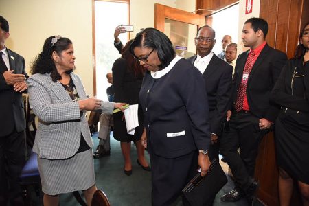 In this June 2017 photograph Marlene McDonald, second from left, arrives with her husband, Michael Carew along with Sea Lots residents Cedric “Burkie” Burke, second from right and Kenroy Dopwell at the Office of the President in St Ann’s for her swearing-in ceremony.