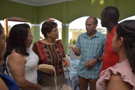 Minister of State,  Dawn Hastings-Williams (left) speaking to some members of the team (Ministry of the Presidency photo)