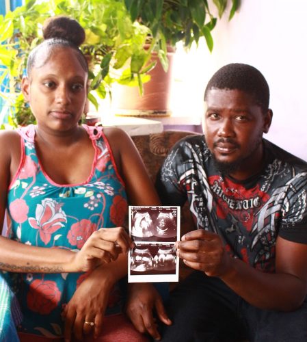 Crystal Carrington and Kurt Goddard hold an ultrasound picture of their daughter Olivia at their San Juan home yesterday.