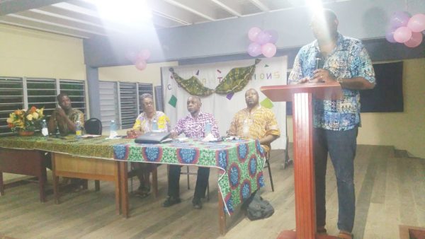 Nigel Hughes speaking yesterday. Seated from right are David Hinds and Carl Greenidge.