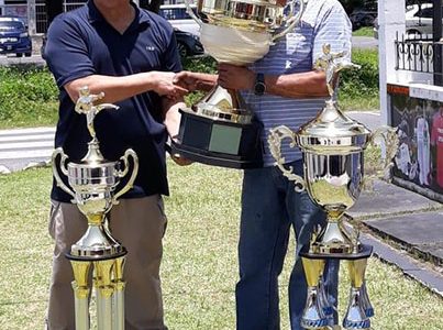 Ramesh Sunich and Frank Woon-A-Tai with the championship trophies. (Photo courtesy of Ramesh Sunich)
