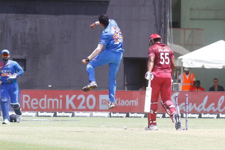 Navdeep Saini celebrates the wicket of Kieron Pollard