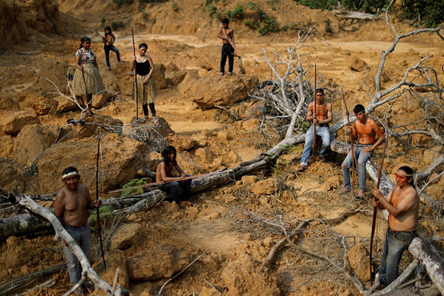 Indigenous people from the Mura tribe show a deforested area in unmarked indigenous lands inside the Amazon rainforest near Humaita, Amazonas State, Brazil August 20, 2019. Picture taken August 20, 2019. REUTERS/Ueslei Marcelino