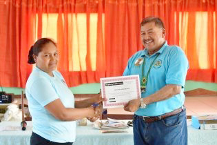One of the participants receiving her certificate from Minister of Indigenous Peoples’ Affairs Sidney Allicock (DPI photo)