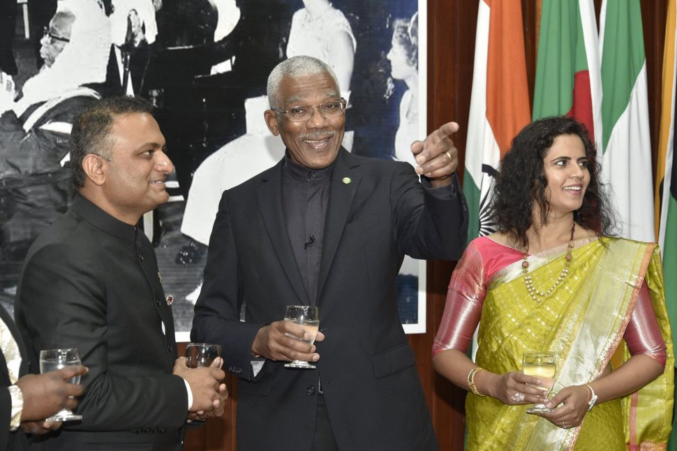 President David Granger (centre) gestures while in conversation with new Indian High Commissioner to Guyana Dr K. J. Srinivasa and Mrs Srinivasa. (Ministry of the Presidency photo)