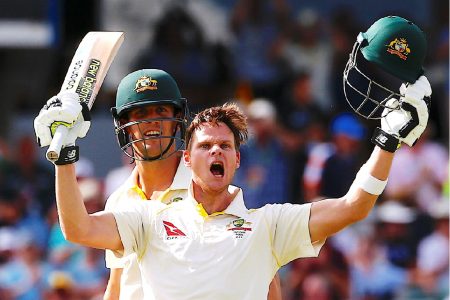 Steve Smith celebrates with team mate Mitchell Marsh after reaching his double century during the third day of the third Ashes cricket test match. REUTERS/David Gray