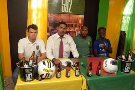 Coordinator of the ‘592 Street Kings’ Tournament, Michelangelo Jacobus (left) and 592 Lager Beer Brand Manager Seweon McGarrell (2nd from left) posing alongside Alexander Village representative Shem Porter (3 from left) and LA Ballers representative Simeon Moore at the official launch of the event
