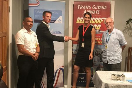 Country Manager of KLM’s Commercial Division Martijn ten Broecke (second from left) and Trans Guyana Airways Commercial Manager Alexandra Correia shaking hands on the new partnership.  Also in this photo are Trans Guyana Airways Operations Manager, Dale King (left) and Communications Consultant Kit Nascimento.