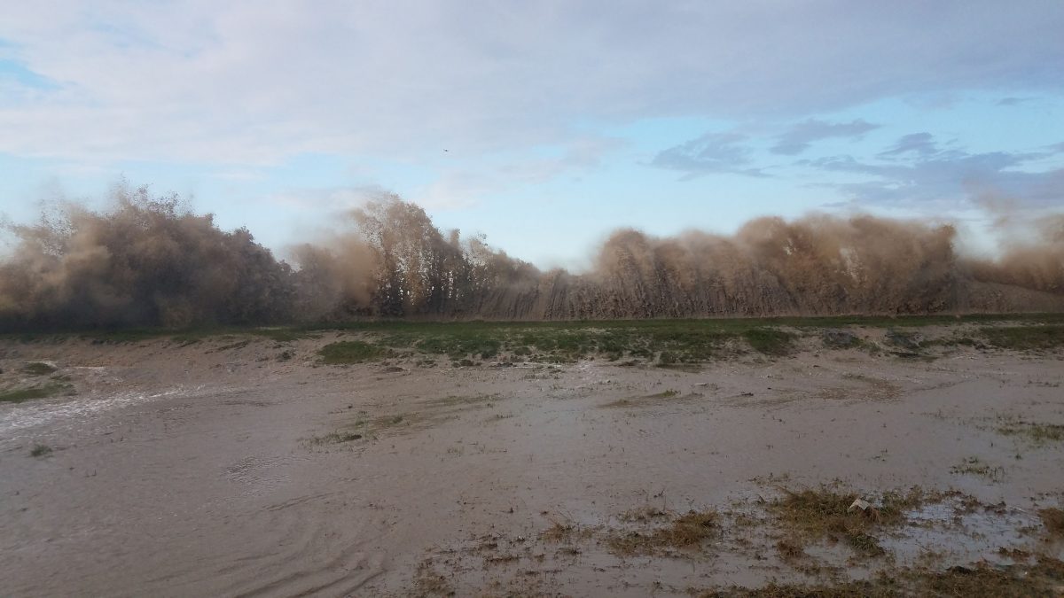 Waves crashing over the seawall at Den Amstel, West Coast Demerara yesterday. [Shamar Meusa photo)