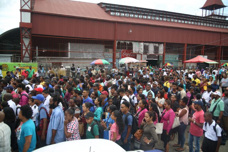 Hundreds of passengers lined up to gain access to boats at the Stabroek Stelling yesterday afternoon. (Photo by Terrence Thompson)
