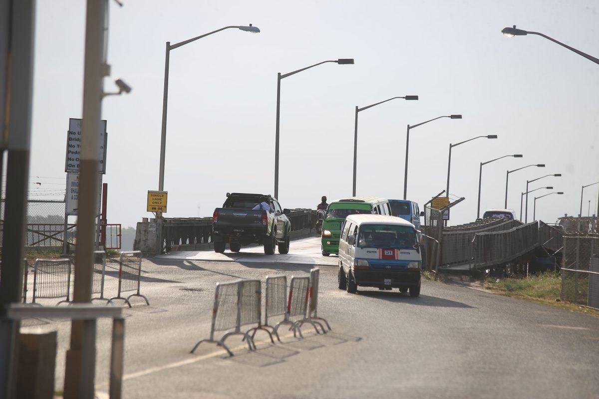 Vehicles moving across the bridge yesterday afternoon. (Photo by Terrence Thompson)