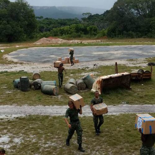 FILE PHOTO: Members of the Guyana Defence Force transporting the hampers from the airstrip to Kaikan in 2018.