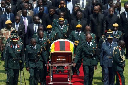 The body of Zimbabwe’s founder and longtime ruler Robert Mugabe is brought to the national sports stadium for a state funeral in Harare, Zimbabwe, September 14, 2019. (REUTERS/Siphiwe Sibeko photo) 