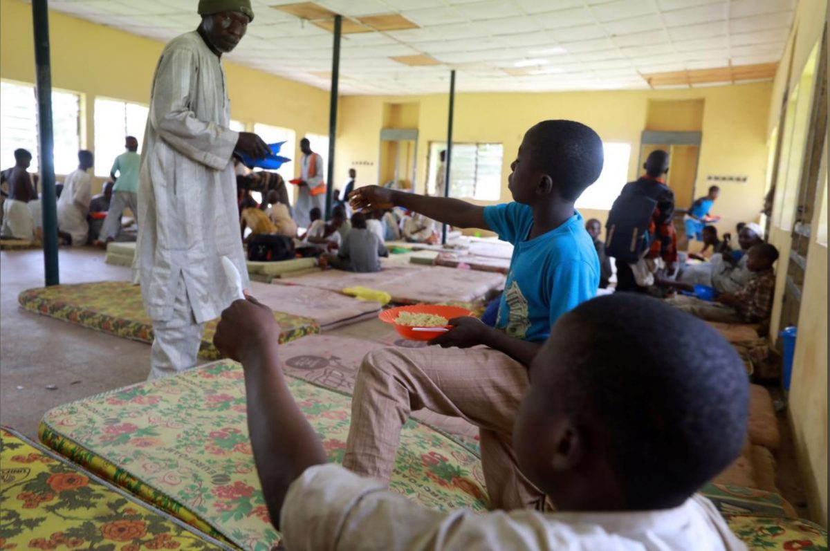 Children rescued from captivity by police are fed by officials at the Hajj transit camp in Kaduna, Nigeria yesterday. (REUTERS/Afolabi Sotunde)
