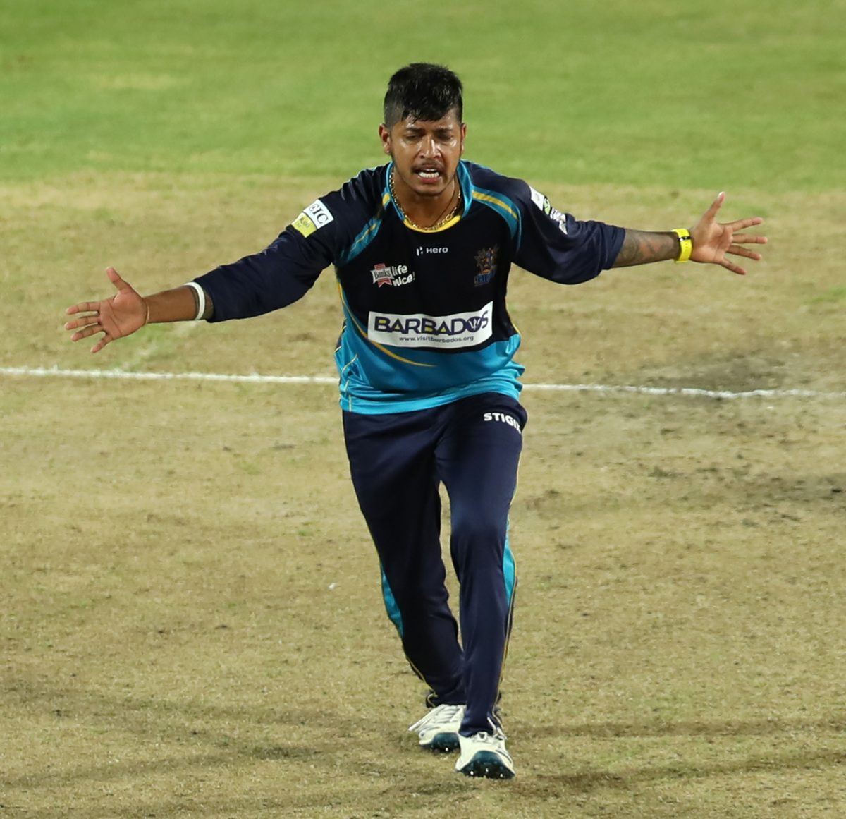  Leg-spinner Sandeep Lamichhane celebrates one of this three wickets in the Caribbean Premier League on Wednesday night. (CPL photo) 