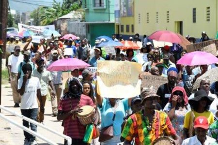 Protesters march along Hanover Street on their way to Gordon House in Kingston, yesterday, where a petition was delivered to Parliament asking that no mining take place in adjoining areas of the Cockpit Country Protected Area. (Photos: Naphtali Junior)