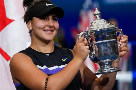Bianca Andreescu of Canada poses with the championship trophy.
