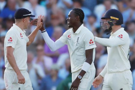 England’s Joffra Archer celebrates with teammates after taking the wicket of Australia’s Peter Siddle. (Reuters photo)
