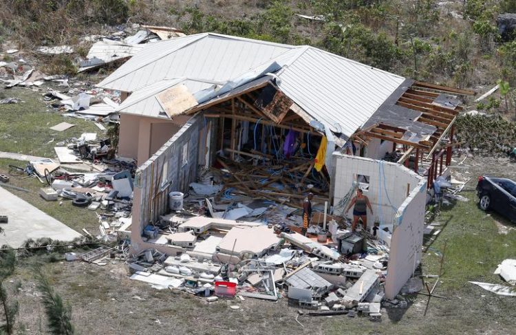 Residents look through debris after hurricane Dorian hit the Grand Bahama Island in the Bahamas, September 4, 2019. REUTERS/Joe Skipper