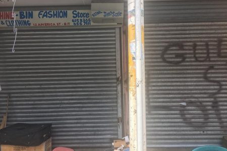   Lie Yang’s store was closed yesterday following the robbery on Friday