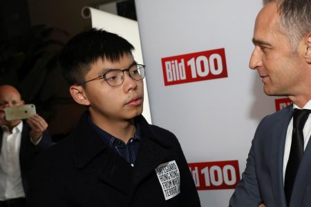 Hong Kong pro-democracy activist Joshua Wong and German Foreign Minister Heiko Maas attend the the summer party "Bild 100" of German publisher Axel Springer at the Reichstag building in Berlin, Germany, September 9, 2019. Picture taken September 9, 2019. REUTERS/Hannibal Hanschke