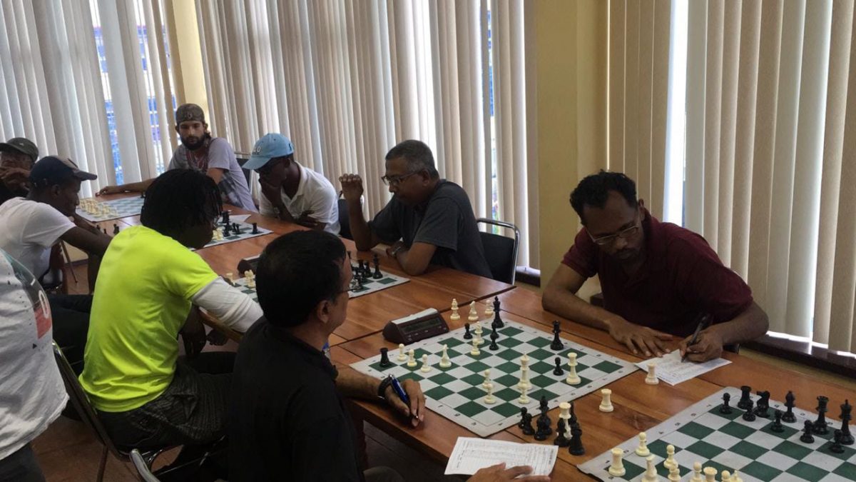 Joint leader Loris Nathoo opposes Guyana Chess Federation president Frankie Farley in their third round encounter of the GAICO sponsored seven round Sweiss System tournament at the National Resource Centre last Sunday
