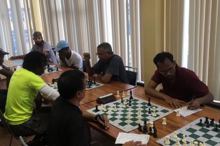 Joint leader Loris Nathoo opposes Guyana Chess Federation president Frankie Farley in their third round encounter of the GAICO sponsored seven round Sweiss System tournament at the National Resource Centre last Sunday
