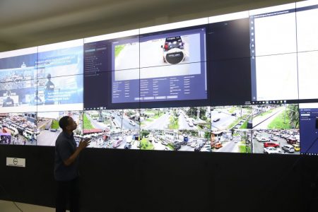 Deputy Head of the National Data Management Authority Francis Simmons demonstrating how the licence plate location history search system component of the CCTV Surveillance system works during a tour in July. (Stabroek News file photo)
