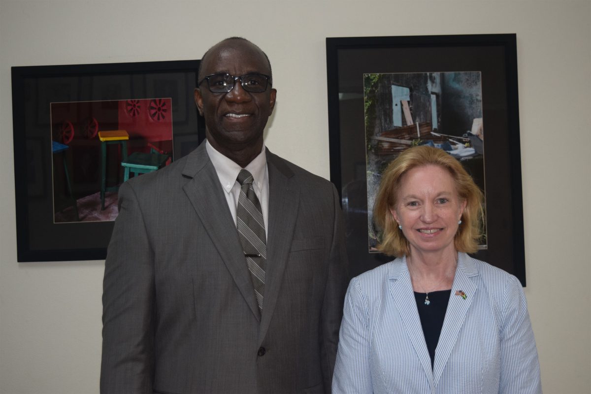 Dr. Norman Munroe [left) with US Ambassador Sarah-Ann Lynch (US Embassy photo) 