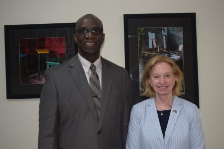 Dr. Norman Munroe (left) with US Ambassador Sarah-Ann Lynch (US Embassy photo)

