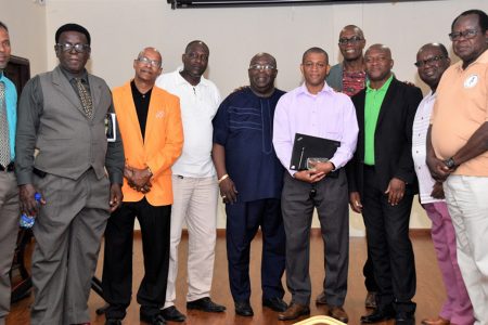 Director, Department of Energy, Dr. Mark Bynoe (fifth from right) along with some of the organizers and participants at the Men’s Regional Convention at the Ramada Hotel, East Bank Demerara. (Ministry of the Presidency photo)