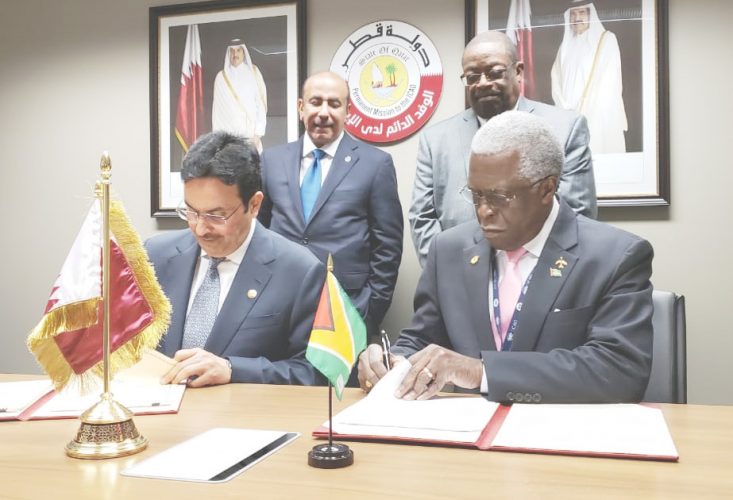 Abdulla Nasser Turki Al Subaey, President, Qatar Civil Aviation Authority (left) and Lt. Col. (Ret’d) Egbert Field, Director General, Guyana Civil Aviation Authority signing the agreement. (GCAA photo)
