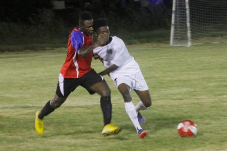 Action between Black Pearl and Santos in the Limacol Football Championship at the Ministry of Education ground, Carifesta Avenue.