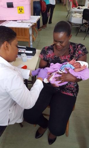 A sample being taken from a new-born baby.